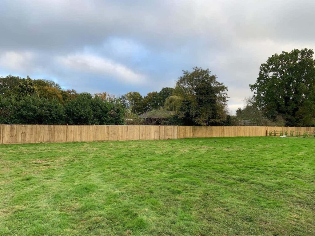 This is a photo of feather edge fencing installed around the edge of a field by Fast Fix Fencing Edenbridge