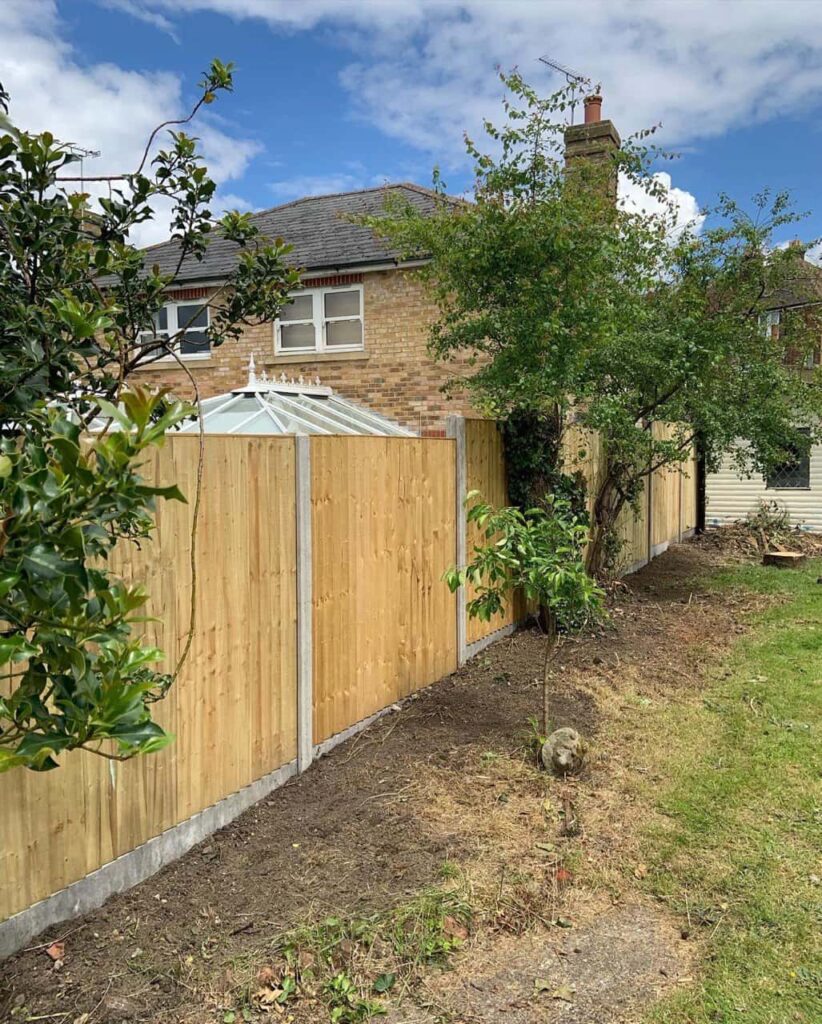 This is a photo of fence panels installed in a residential garden using concrete posts and gravel boards. Installed by Fast Fix Fencing Edenbridge